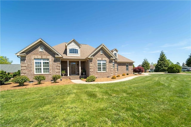 craftsman-style house with brick siding and a front lawn