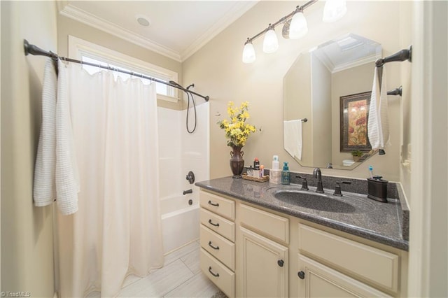 bathroom featuring crown molding, vanity, and shower / bath combo with shower curtain