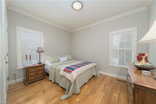 bedroom featuring light wood-type flooring, baseboards, ornamental molding, and multiple windows
