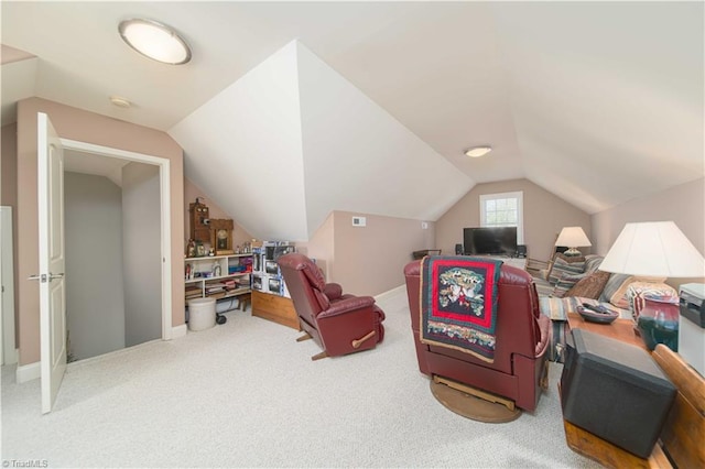 interior space featuring vaulted ceiling, baseboards, and carpet