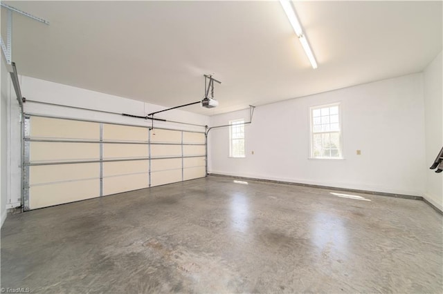 garage featuring baseboards and a garage door opener
