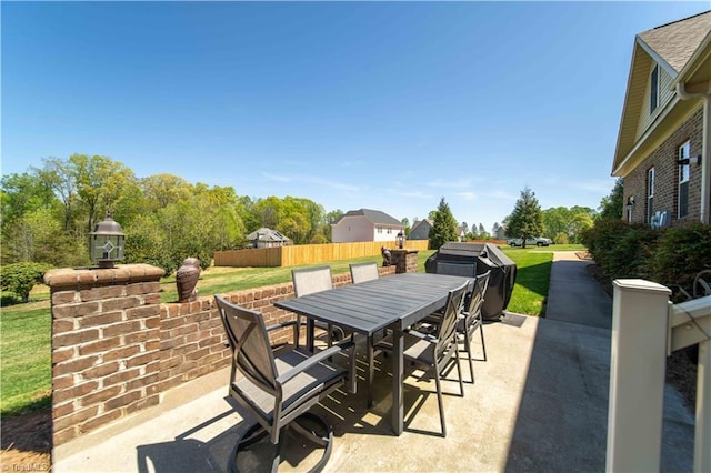 view of patio / terrace with outdoor dining area, fence, and area for grilling