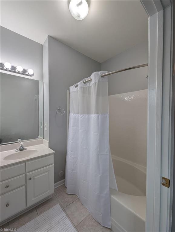 full bathroom with vanity, tile patterned flooring, and shower / bathtub combination with curtain