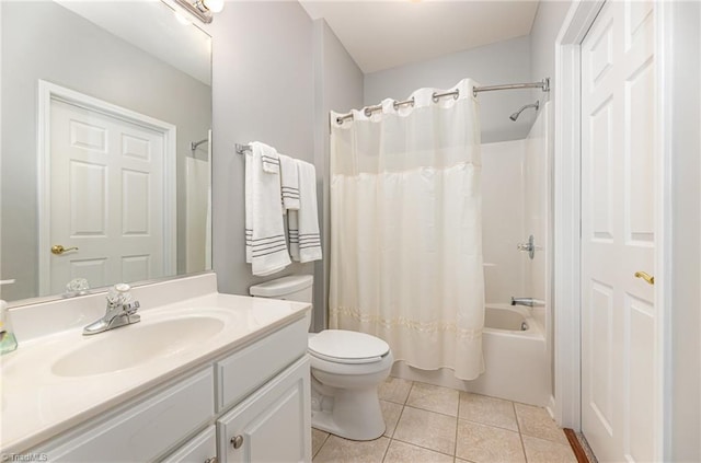 full bathroom featuring vanity, shower / tub combo with curtain, tile patterned floors, and toilet