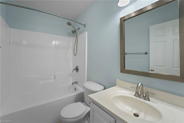 bathroom with tub / shower combination, toilet, and vanity