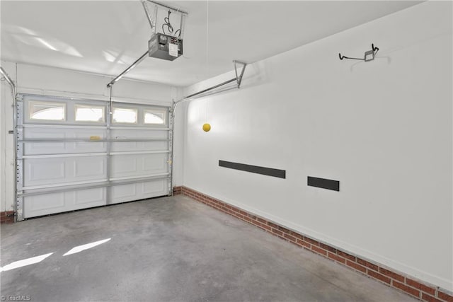 garage featuring a garage door opener