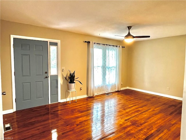 foyer with ceiling fan and wood-type flooring