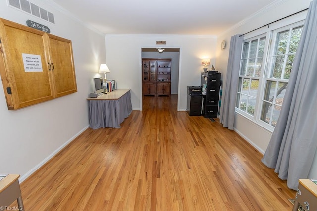 hallway featuring wood-type flooring and ornamental molding