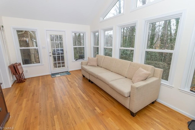 sunroom with a wealth of natural light and vaulted ceiling