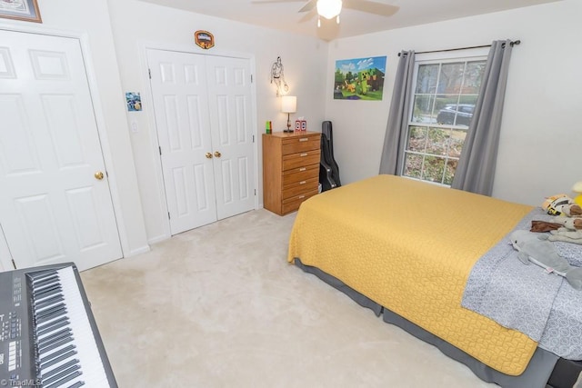 bedroom with light carpet and ceiling fan