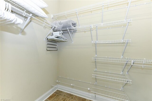 walk in closet featuring tile patterned flooring