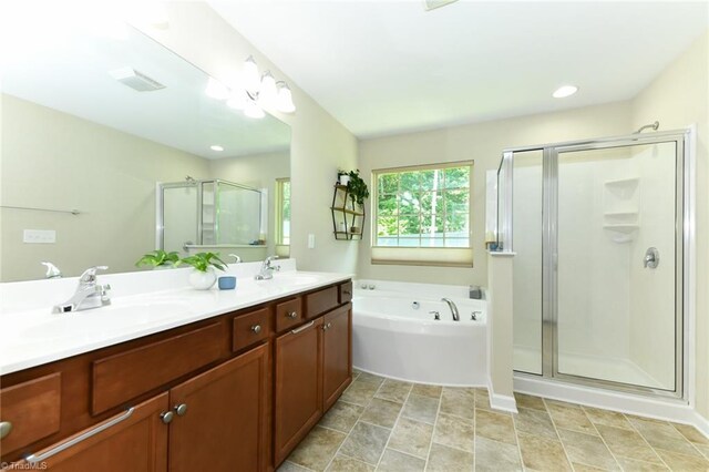 bathroom with vanity and plus walk in shower