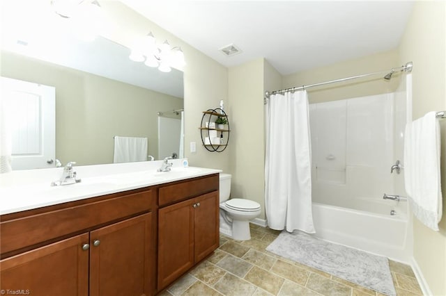 full bathroom with shower / bath combination with curtain, vanity, and toilet