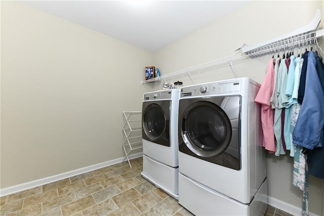 laundry area with separate washer and dryer