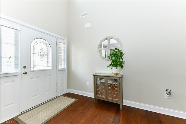 foyer with dark hardwood / wood-style floors