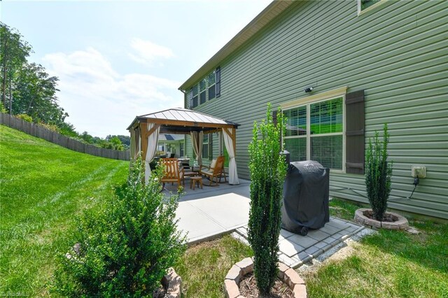 view of patio / terrace featuring a gazebo and area for grilling