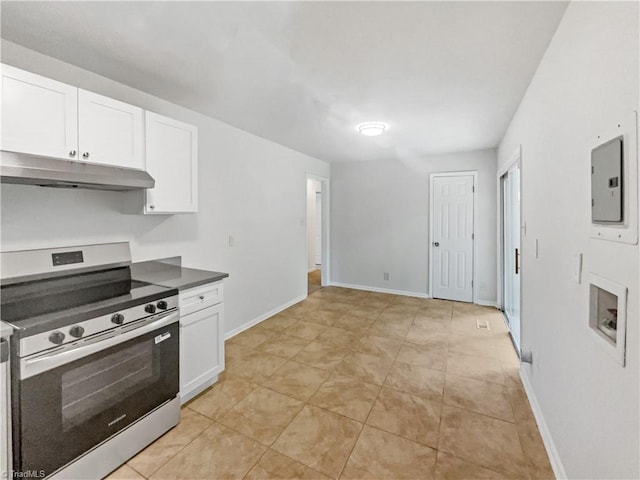 1606 Woodbriar Ave, Greensboro, NC 27405 - kitchen featuring electric stove, under cabinet range hood, white cabinets, and dark countertops