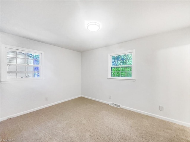 1606 Woodbriar Ave, Greensboro, NC 27405 - unfurnished room featuring light colored carpet and baseboards