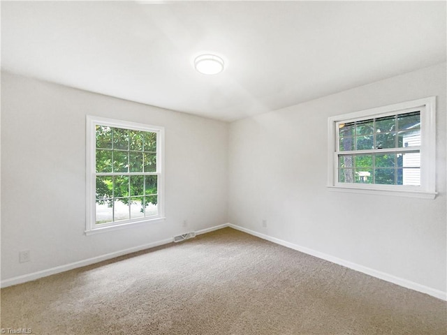 1606 Woodbriar Ave, Greensboro, NC 27405 - spare room with carpet