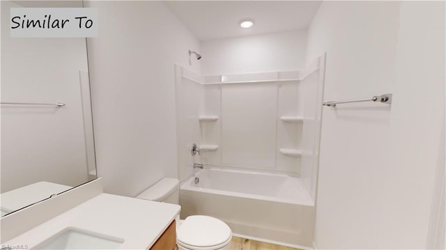 full bathroom with toilet, shower / bathing tub combination, and vanity