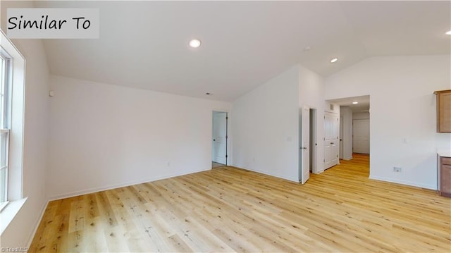 interior space with vaulted ceiling and light hardwood / wood-style floors