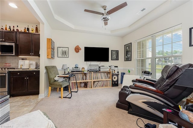 275 Obsidium Ct, Gibsonville, NC 27249 - living area with ceiling fan, a raised ceiling, and light carpet