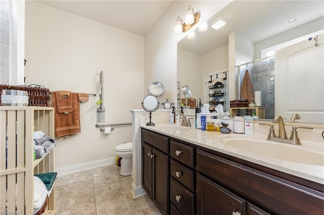 275 Obsidium Ct, Gibsonville, NC 27249 - full bathroom with double vanity, toilet, baseboards, and tiled shower
