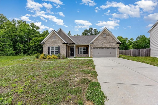 275 Obsidium Ct, Gibsonville, NC 27249 - view of front of house featuring brick siding, an attached garage, and concrete driveway