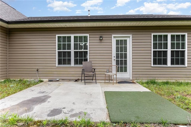 275 Obsidium Ct, Gibsonville, NC 27249 - view of exterior entry with a patio