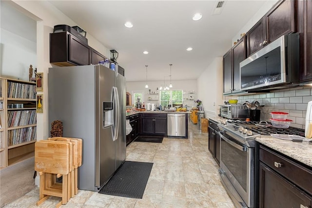 275 Obsidium Ct, Gibsonville, NC 27249 - kitchen with appliances with stainless steel finishes, dark brown cabinetry, recessed lighting, and decorative backsplash