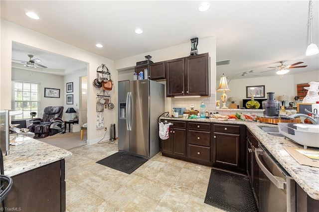 275 Obsidium Ct, Gibsonville, NC 27249 - kitchen with stainless steel appliances, open floor plan, a ceiling fan, and recessed lighting