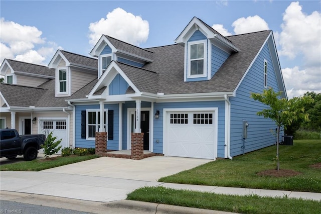 view of front of home featuring a front lawn and a garage