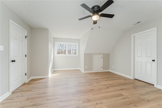 bonus room with visible vents, light wood-style flooring, and baseboards