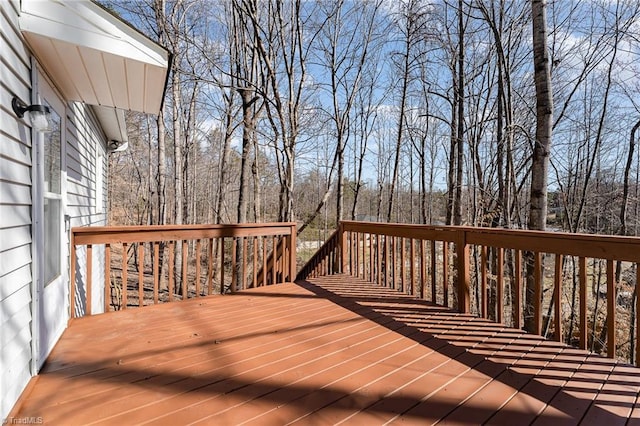 deck featuring a wooded view