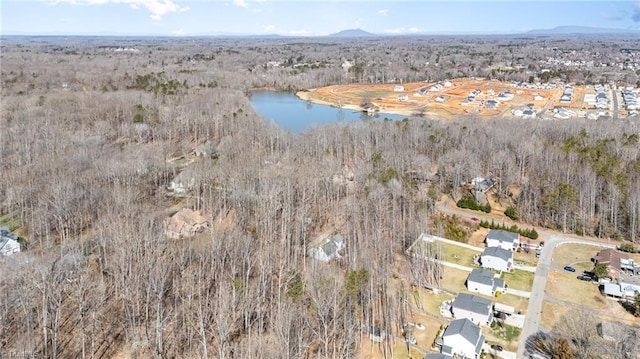 bird's eye view featuring a water view and a view of trees