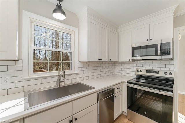 kitchen featuring white cabinetry and stainless steel appliances