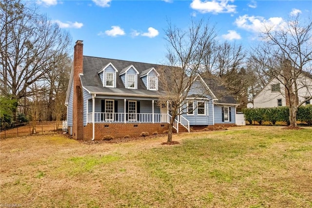 cape cod home featuring a porch and a front lawn