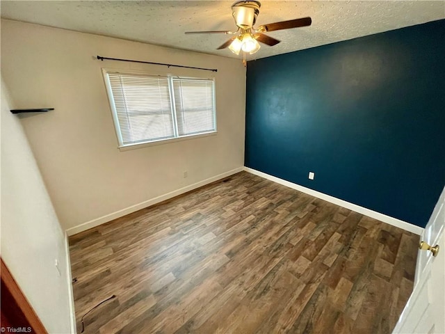 spare room with hardwood / wood-style flooring, ceiling fan, and a textured ceiling