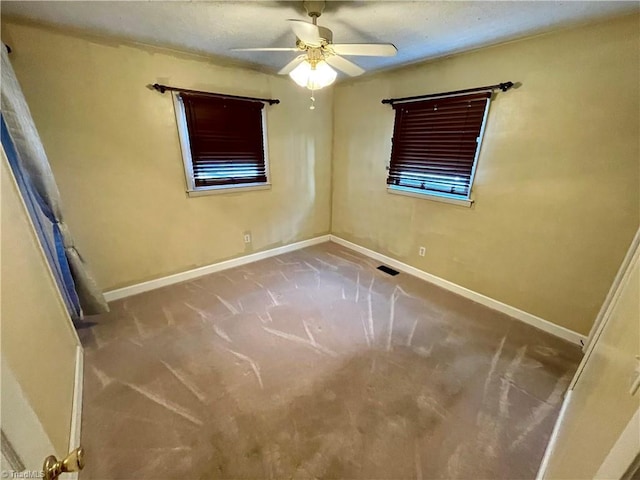 unfurnished room with carpet floors and ceiling fan