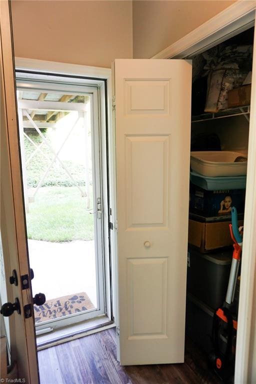 doorway to outside with dark wood finished floors
