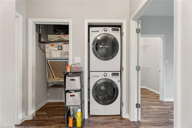 226 Lola Ln Unit 102, Pilot Mountain, NC 27041 - clothes washing area with estacked washer and dryer, dark wood-type flooring, baseboards, and heating unit