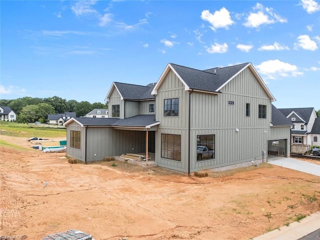 1341 Maple Chase Ln, Winston-Salem, NC 27106 - view of side of property with board and batten siding, roof with shingles, and driveway
