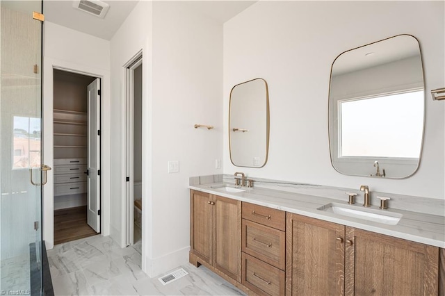 1341 Maple Chase Ln, Winston-Salem, NC 27106 - bathroom with marble finish flooring, double vanity, healthy amount of natural light, and a shower stall