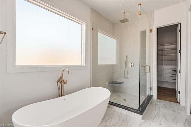 1341 Maple Chase Ln, Winston-Salem, NC 27106 - full bath with a stall shower, a freestanding bath, marble finish flooring, and a spacious closet