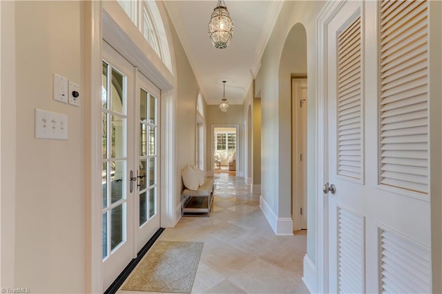 hall featuring crown molding and french doors