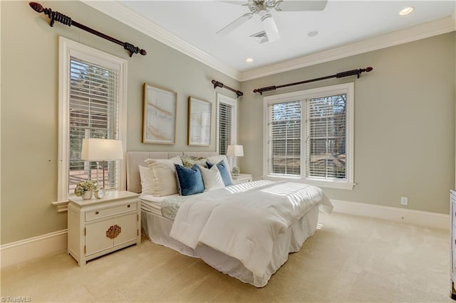 bedroom with ornamental molding, light carpet, and ceiling fan