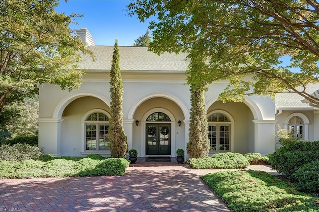 property entrance featuring french doors