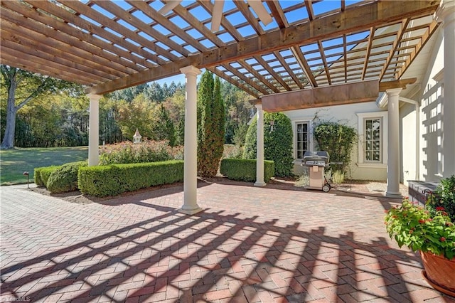 view of patio / terrace featuring area for grilling and a pergola