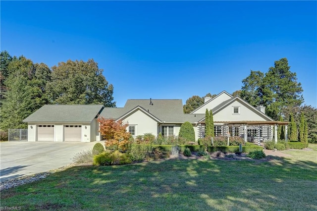 ranch-style house with a garage and a front lawn