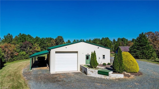 exterior space with an outbuilding and a garage